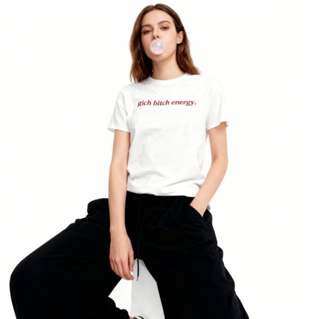 A female model blowing bubble gum, wearing the white